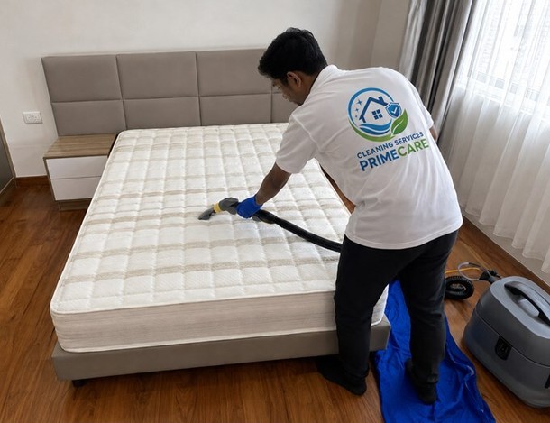 Mattress cleaning service in Malaysia — Cleaning Services Primecare technician deep cleaning a mattress