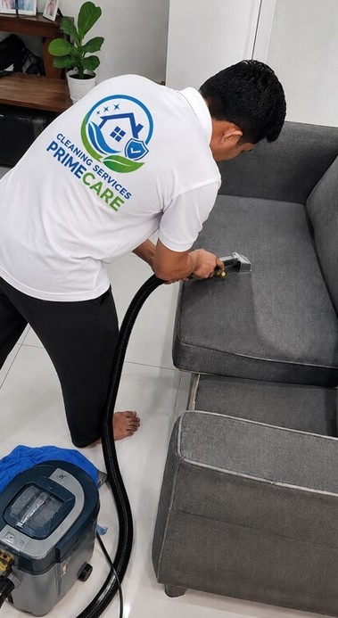 Cleaning Services Primecare technician steam extracting a fabric sofa